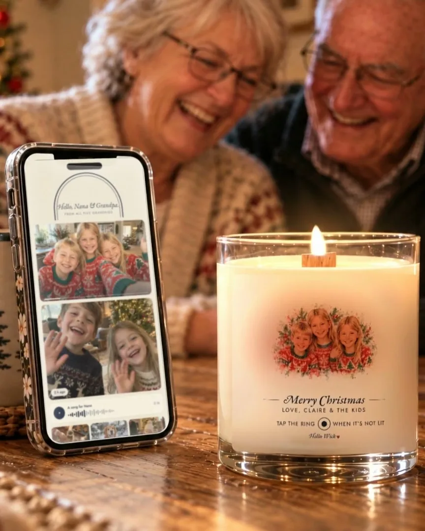 Grandparents by the Christmas tree tap their phone to a Hello Wick candle, the grandkids appear on the screen, and they light it
